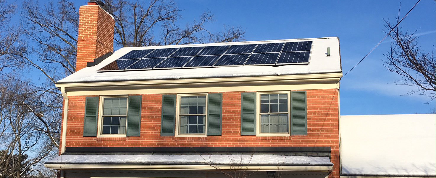 A house with a rooftop array of solar panels